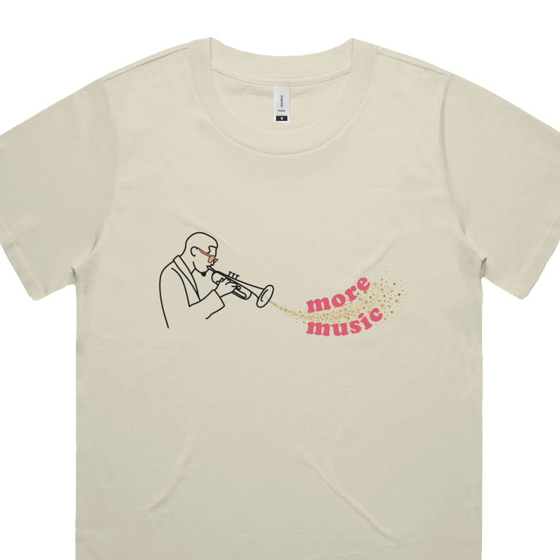 Beige t-shirt with a graphic of a person playing a trumpet and 'more music' text on a white background